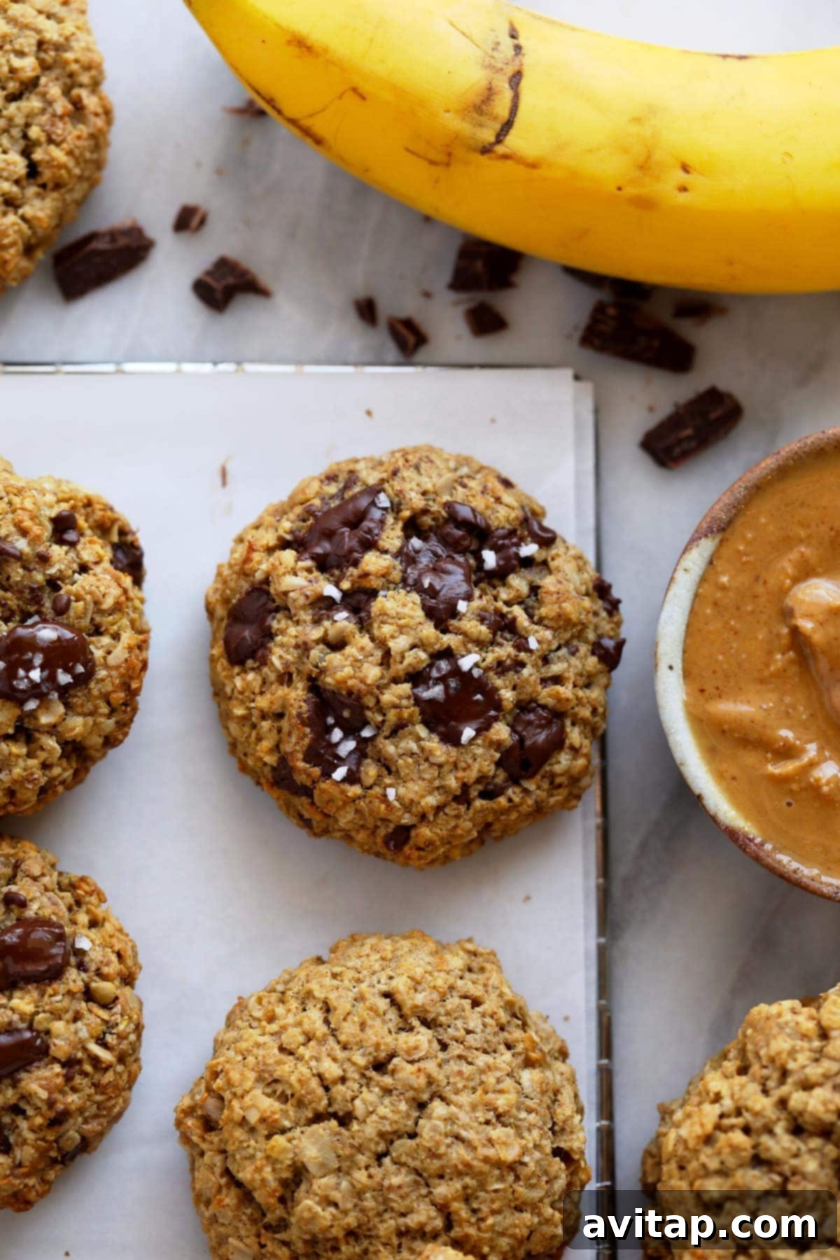 Freshly baked Peanut Butter Banana Cookies arranged neatly on a wire cooling rack, ready to be enjoyed.