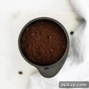 Coffee grounds in a grinder, ready for use.