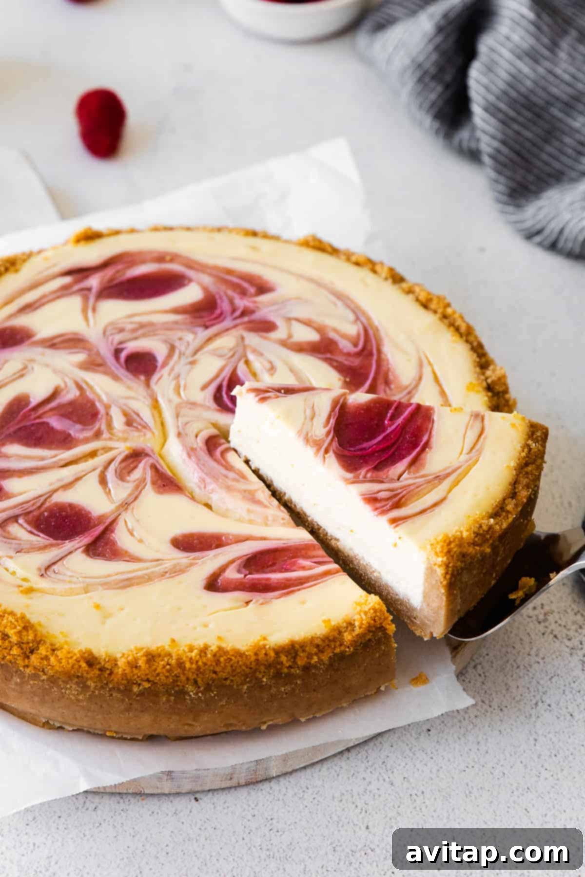 A perfectly sliced piece of creamy Greek yogurt cheesecake, showcasing its smooth texture and elegant simplicity.