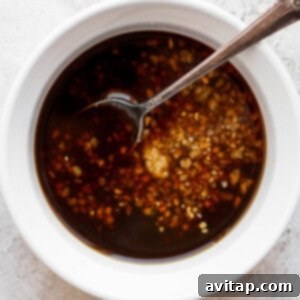 Marinade ingredients mixed in a bowl, showing a smooth, cohesive liquid.