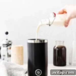Frothing creamer in an electric frother until it forms a thick foam.