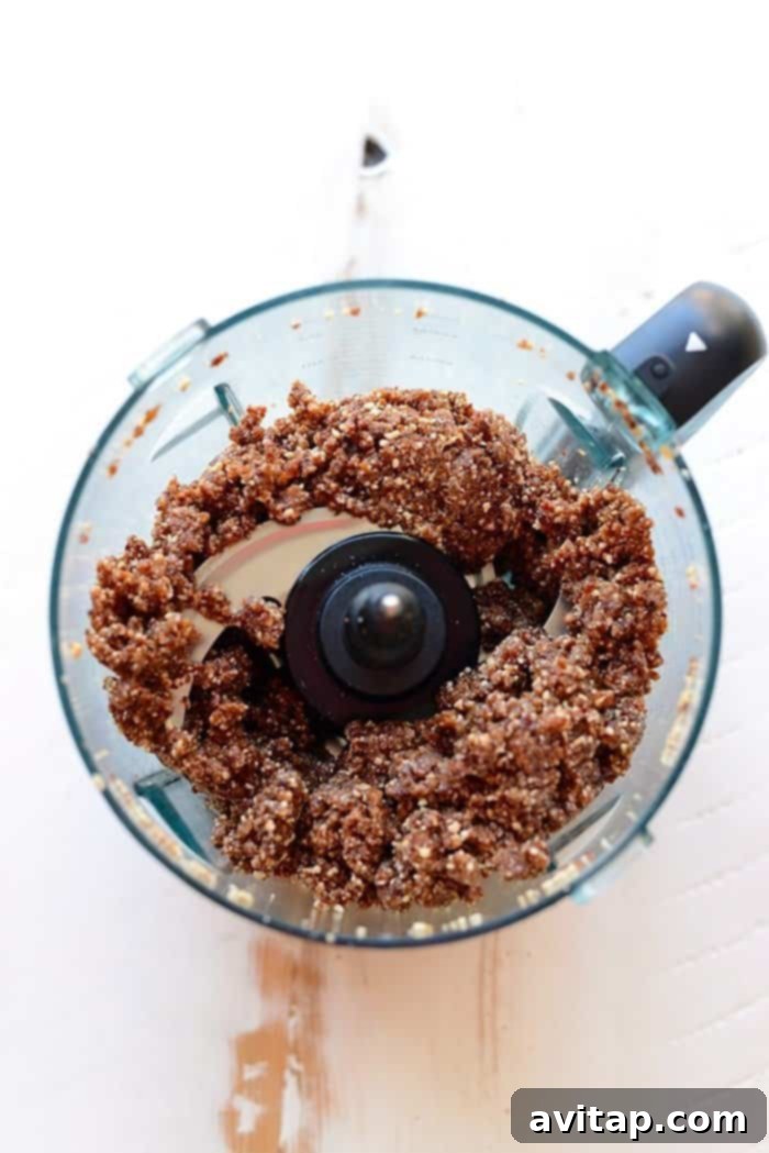 A close-up shot of Cherry Pie Energy Balls, emphasizing their perfectly rounded shape and texture.