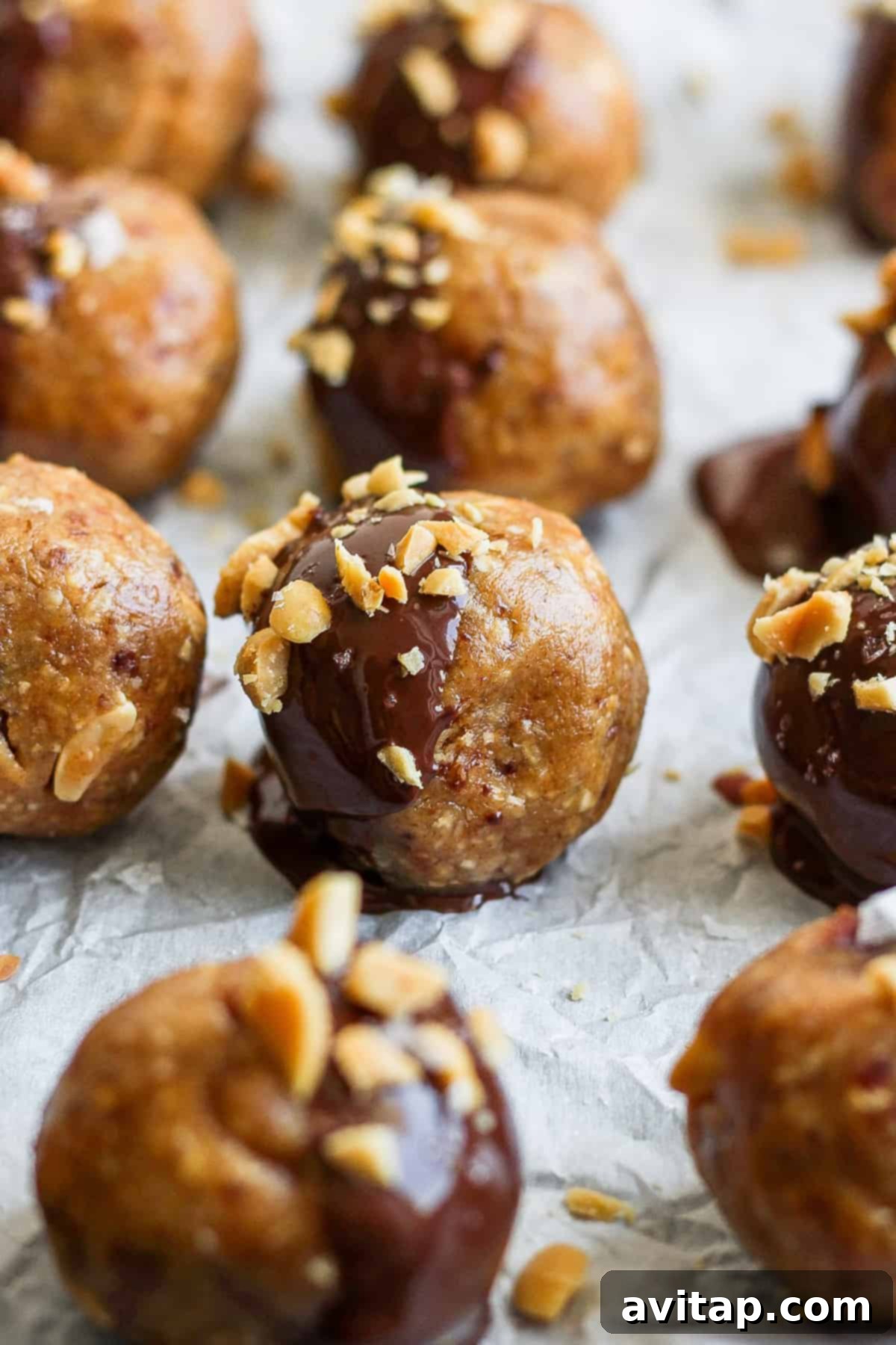 No Bake Snickers Fuel Bites 2 Peanut butter and chocolate bites arranged beautifully on a baking sheet, ready to be enjoyed.