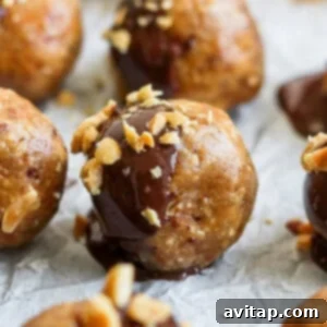 A plate of decadent chocolate covered peanut butter balls, showcasing their delicious coating and topping.