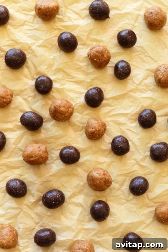 Healthy no-bake peanut butter and jelly inspired energy balls with a swirl pattern, made from dried fruit and nuts, perfect for a grab-and-go snack.