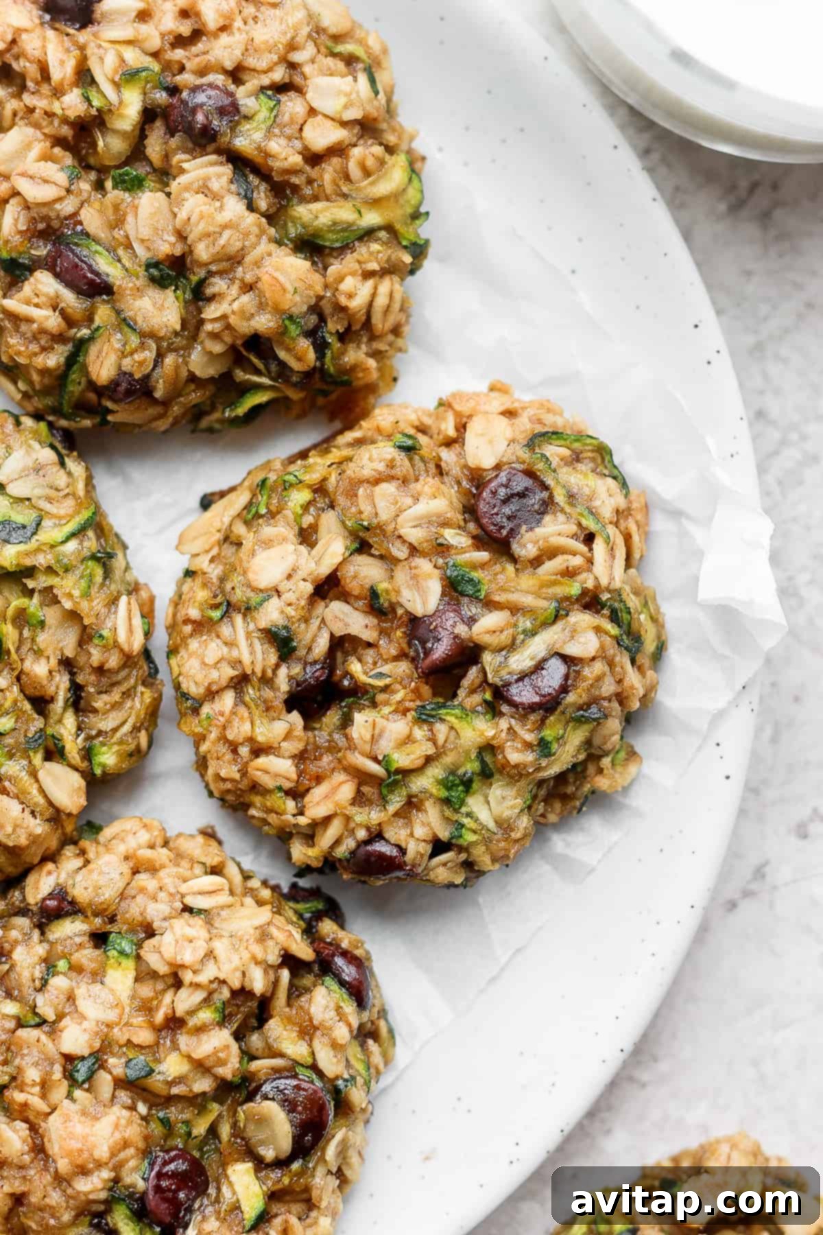 Healthy Oatmeal Zucchini Cookies 2 Freshly baked zucchini oatmeal cookies arranged on a plate.