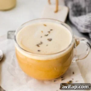 Effortless London Fog Delight 2 A cup of London fog lavender latte with a spoon on a napkin.
