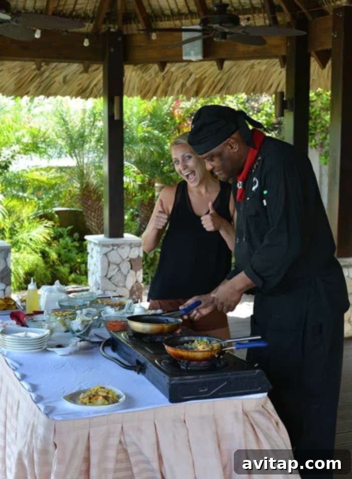 Influencer participating in a Jamaican cooking class at Sandals Ochi Beach Resort, learning traditional dishes like Ackee and Saltfish during a Funjet Vacations sponsored trip.