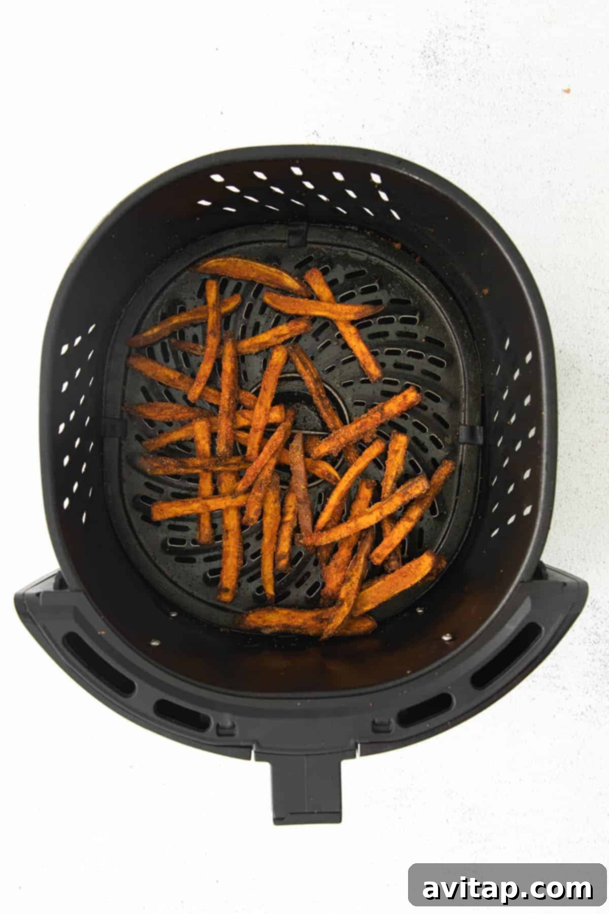 Air-Fried Sweet Potato Perfection 8 Perfectly air-fried sweet potato fries piled high in a bowl, showing their golden color and crisp texture