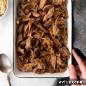 Effortless Slow Cooker Pulled Pork 3 pulled pork in dish