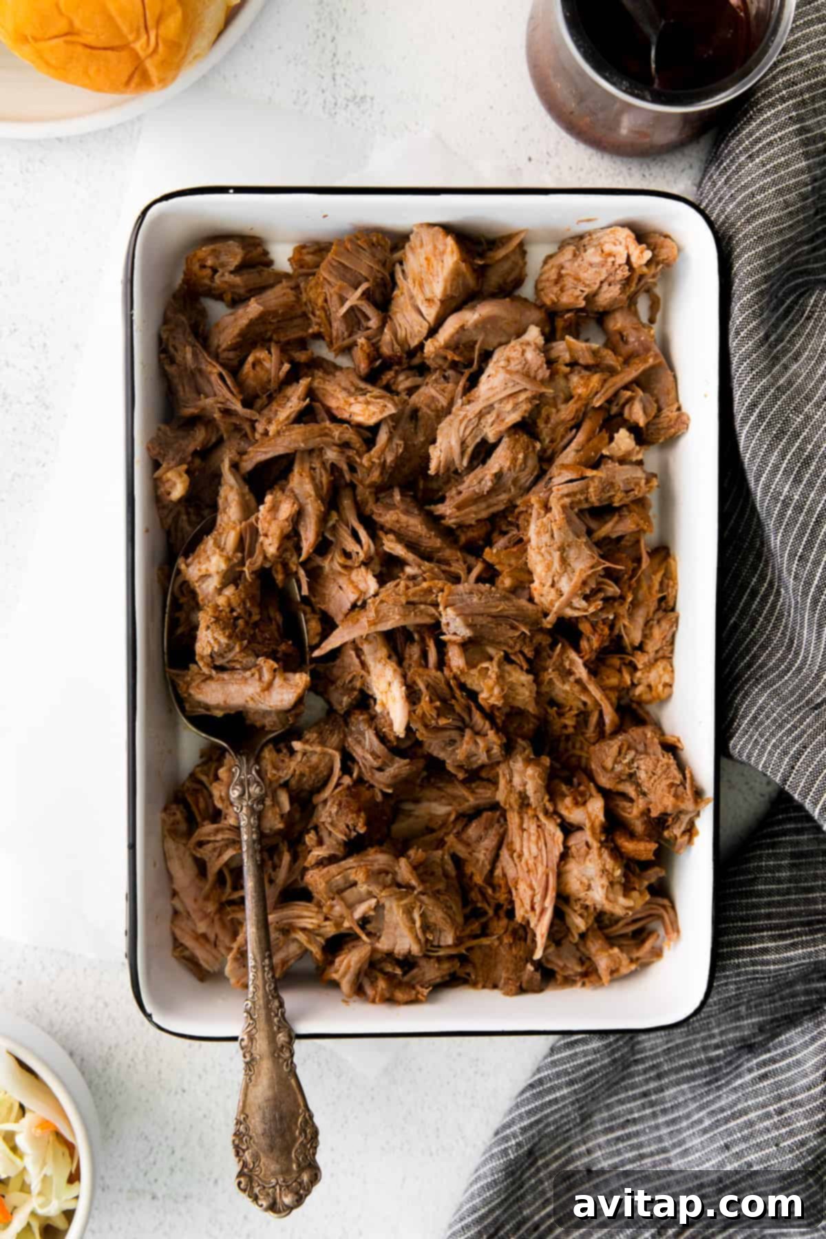 A generous serving of slow cooker pulled pork Delicious pulled pork served in a rustic dish