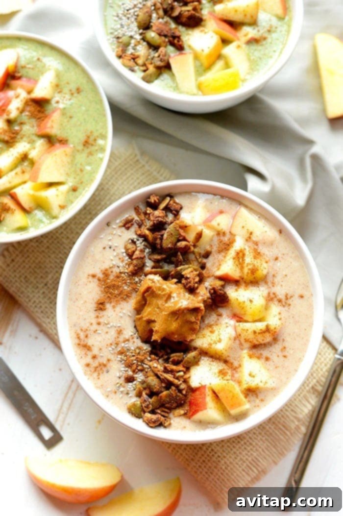 Explore delicious red and green apple variations of our healthy Apple Pie Smoothie Bowl. Two vibrant apple pie smoothie bowls, one red apple and one green apple variation, garnished with fresh fruit and granola.