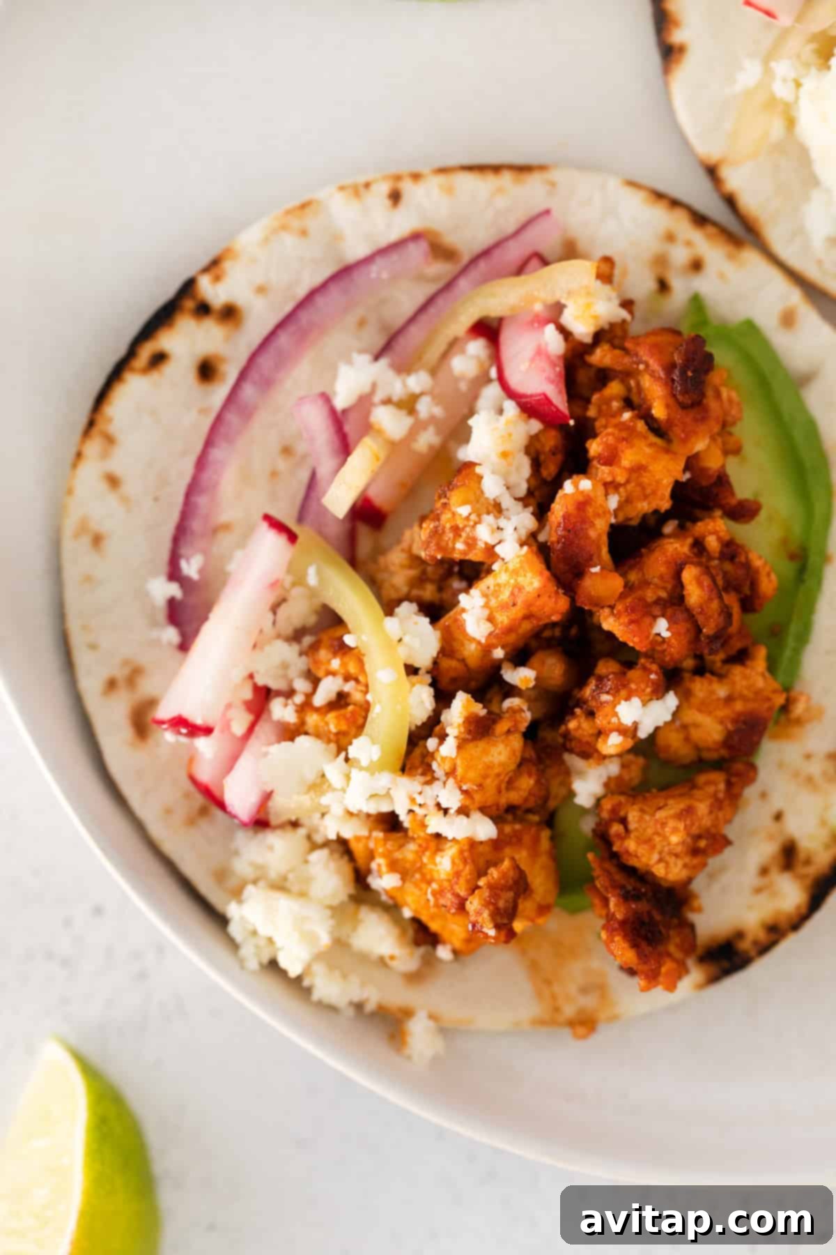 Flavorful Tofu Tacos 11 Tofu tacos in a flour tortilla.