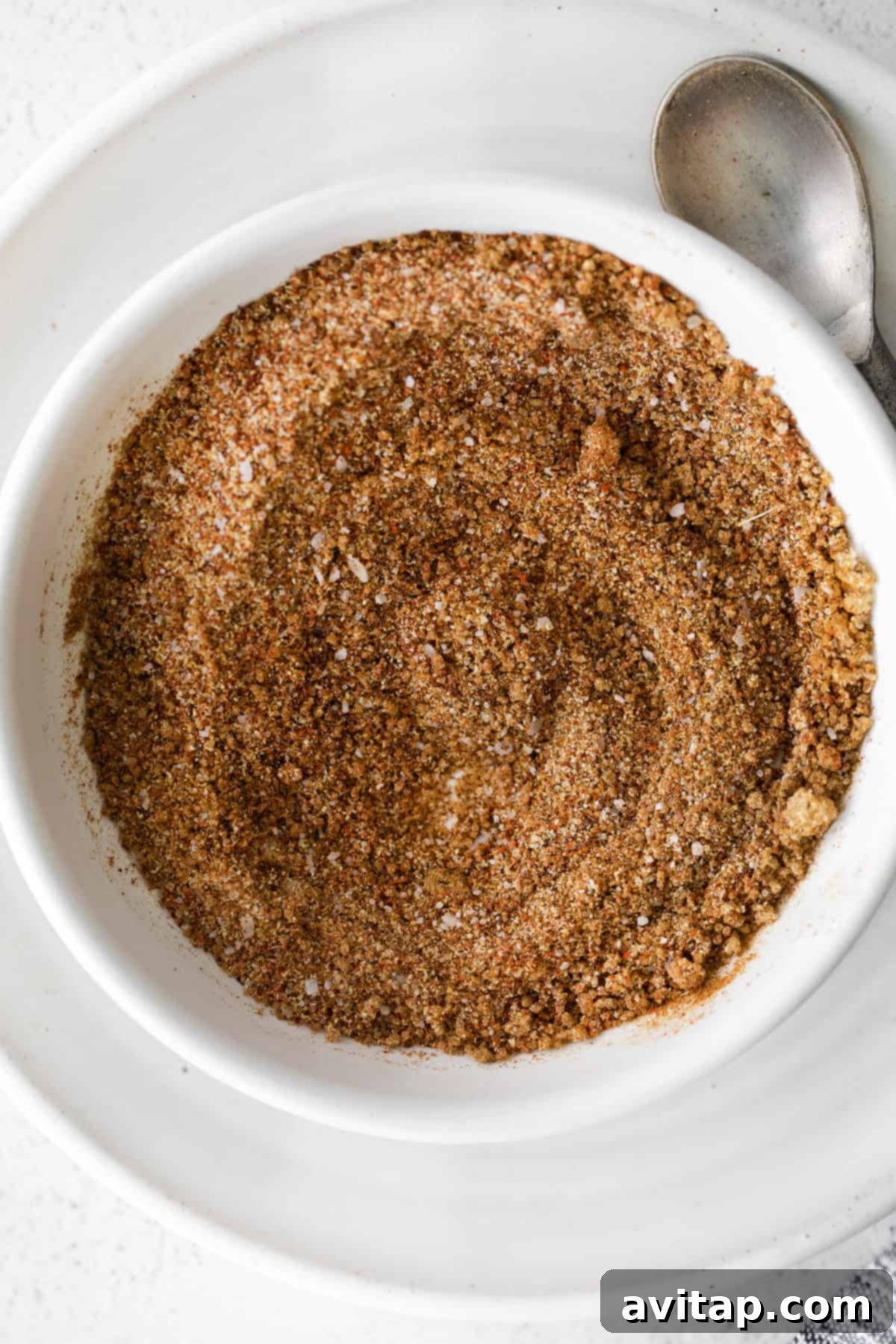 All the mixed ingredients for steak taco seasoning in a small bowl, showcasing the rich colors of the spice blend.