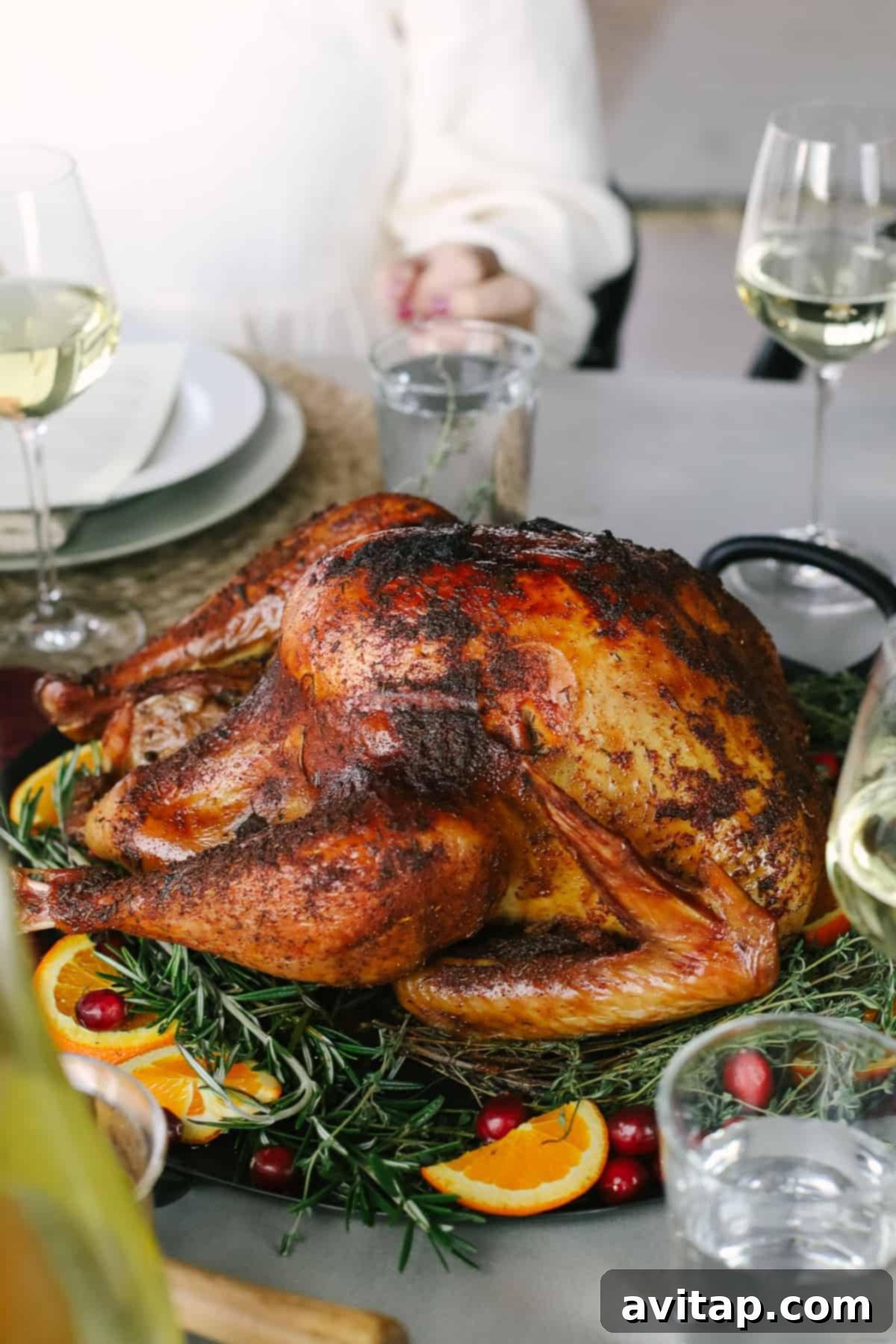 Smoked Turkey Perfection 2 A perfectly smoked turkey resting on a platter, showcasing its golden-brown, crispy skin and tempting aroma.