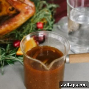 Smoked Turkey Perfection 19 Rich, smooth turkey gravy poured into a classic gravy boat, ready to serve.