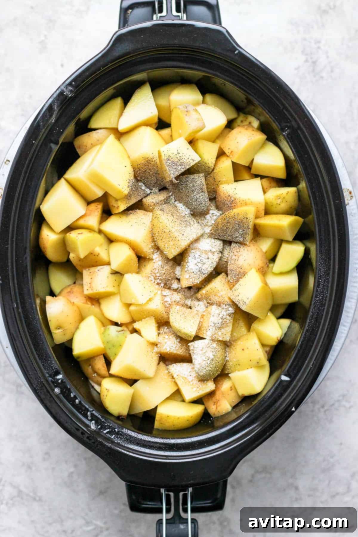 Diced Yukon Gold potatoes, ready to be cooked in a crockpot for mashed potatoes.