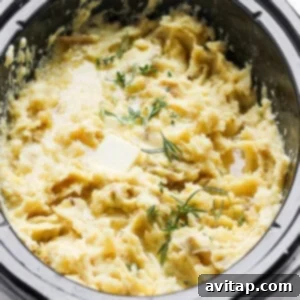 Diced potatoes in a crockpot, before cooking, for a delicious mashed potato recipe.