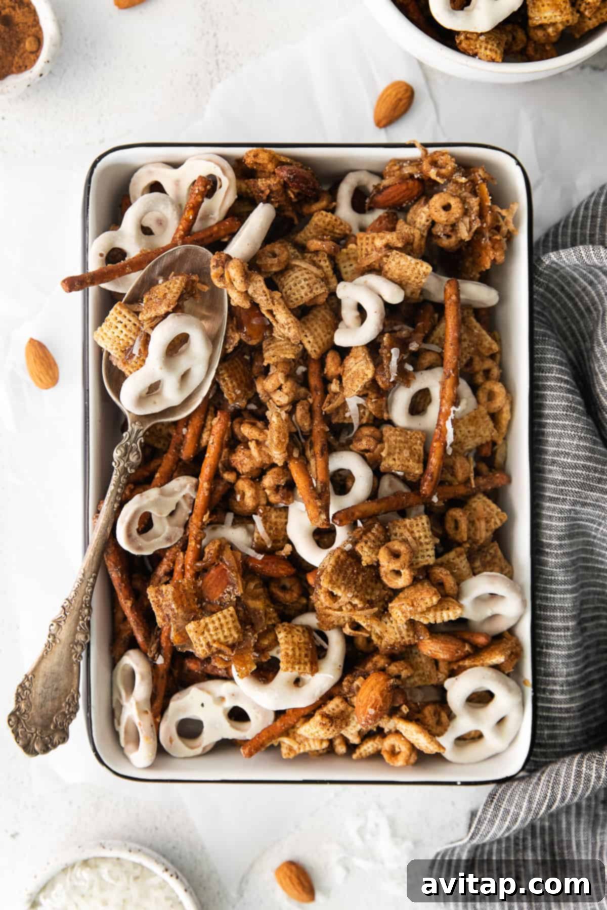 Delicious Chai Chex Mix artfully arranged in a rustic pan, showcasing its crunchy texture and inviting autumn colors.