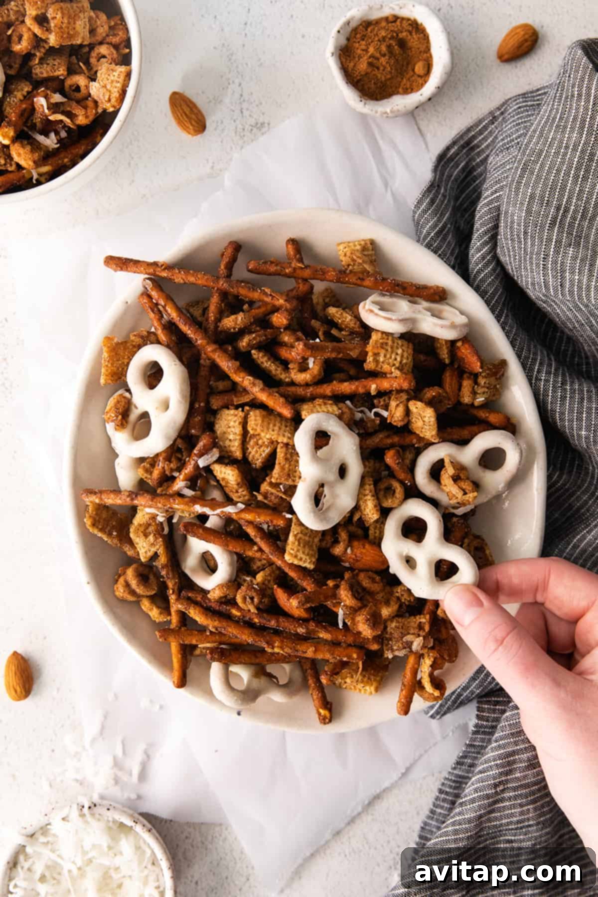 A large serving of freshly made Chai Chex Mix, highlighting its sweet, salty, and spicy crunch, perfect for autumn snacking.