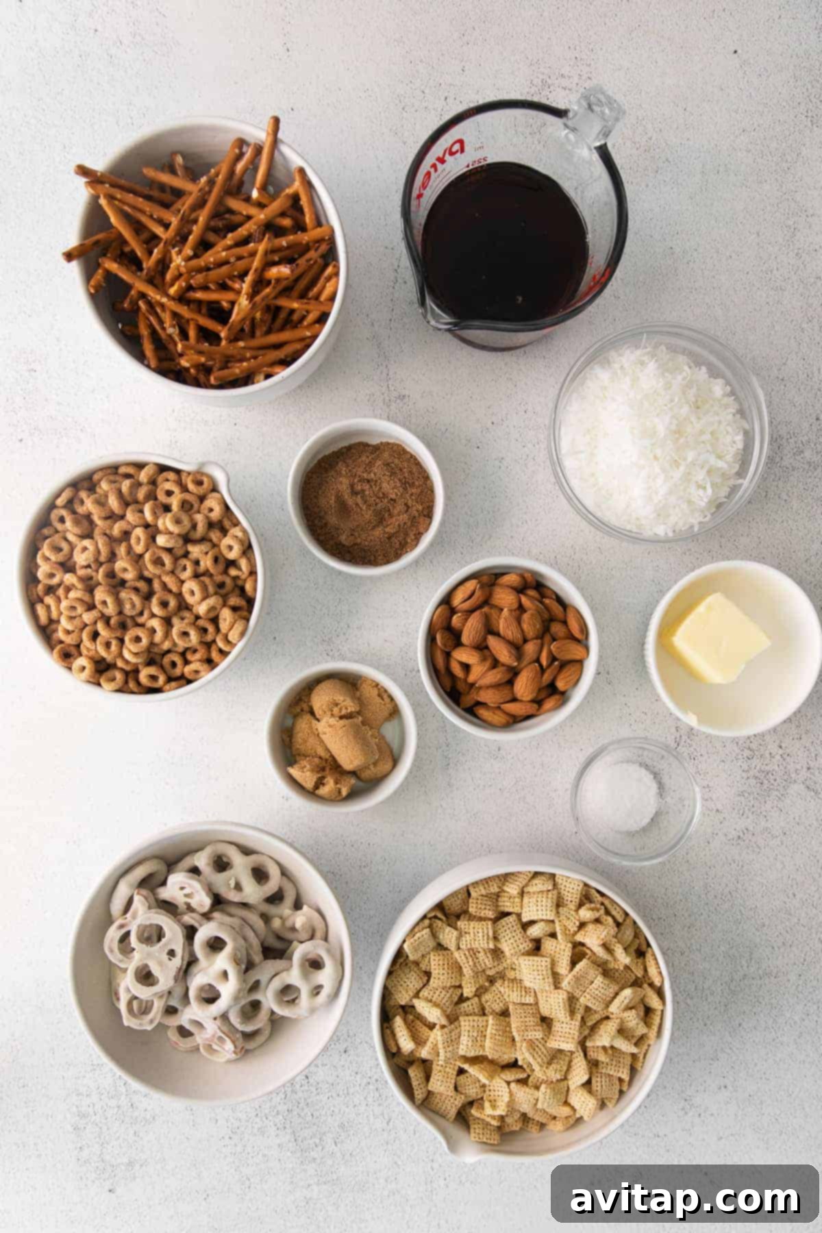A vibrant display of fresh ingredients for Chai Chex Mix spread out on a kitchen counter, ready for preparation.