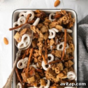 Chai Chex Mix featuring a delightful blend of almonds, pretzels, and other tasty ingredients.