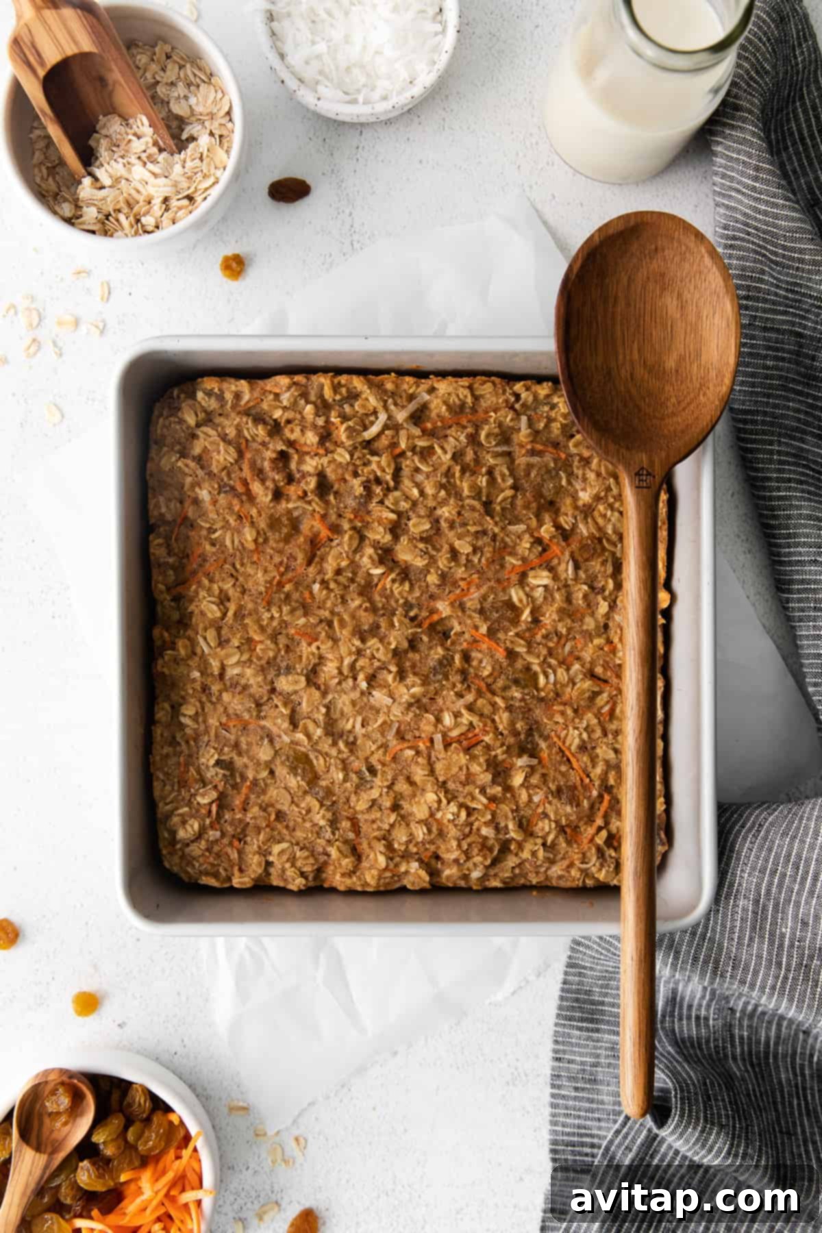 Morning Glory Baked Oatmeal Fresh from Oven A beautifully baked Morning Glory Baked Oatmeal, golden brown and inviting, resting in a square baking pan, ready to be sliced.