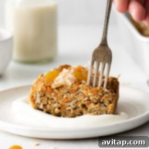 A freshly baked pan of Morning Glory Baked Oatmeal, golden brown and ready to be served, perfect for a wholesome breakfast.