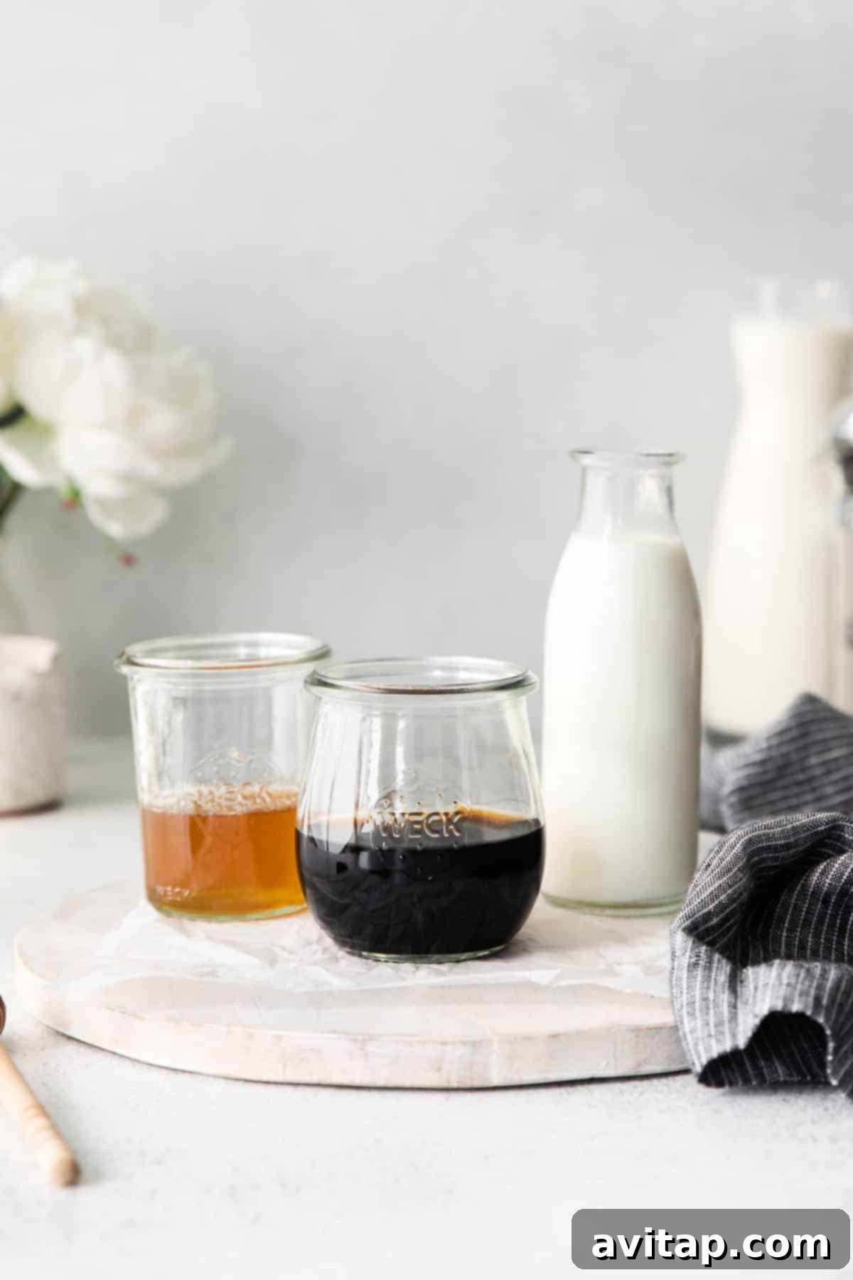 All the fresh ingredients for a miel latte carefully arranged in elegant glass weck jars, showcasing their natural quality.