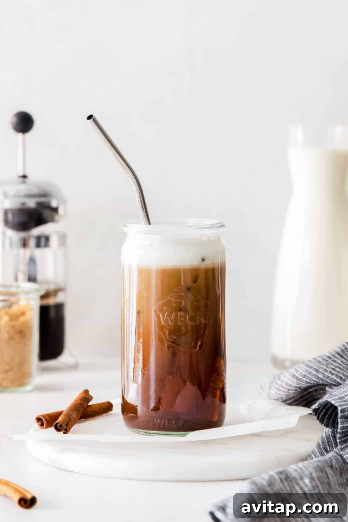 Homemade Iced Brown Sugar Oat Milk Shaken Espresso A refreshing glass of homemade Iced Brown Sugar Oat Milk Shaken Espresso with ice and a straw.