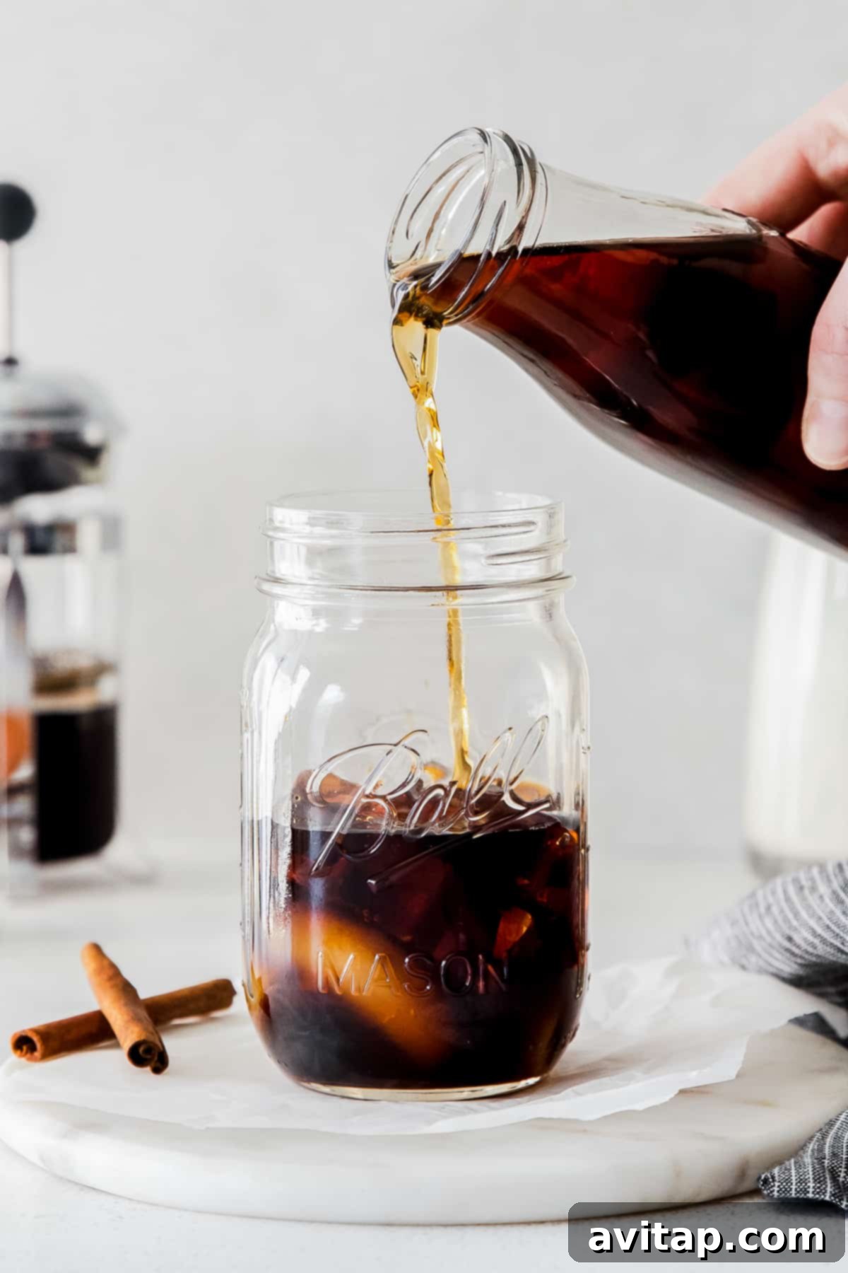 Espresso for Shaken Espresso Pouring fresh espresso into a glass, a key step in making the shaken espresso.