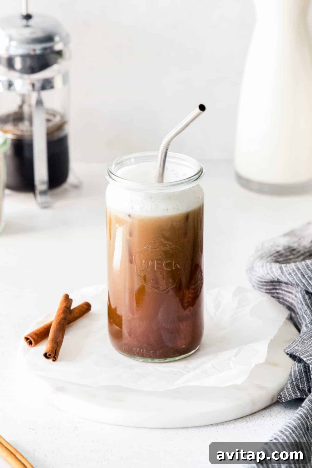 Finished Shaken Espresso A finished Iced Brown Sugar Oat Milk Shaken Espresso with a straw, ready to drink.