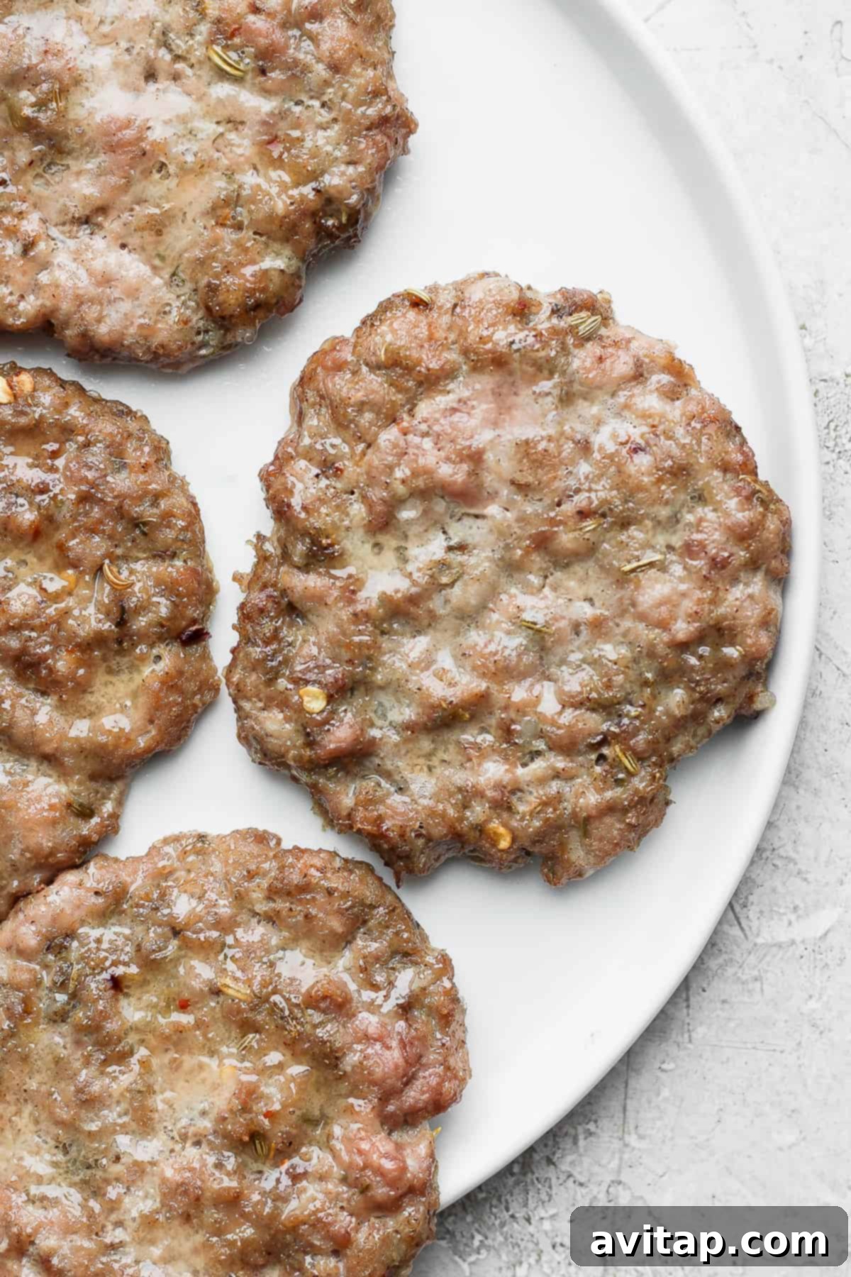 Delicious homemade maple breakfast sausage patties arranged beautifully on a plate, ready to be served for breakfast.