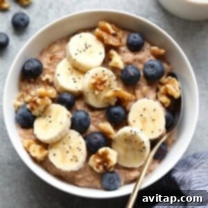 A delicious bowl of healthy oatmeal topped with fresh fruit and nuts, highlighting its appeal.