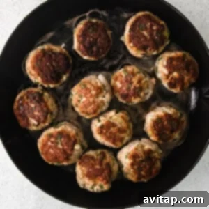 Fully cooked and browned turkey meatballs in a skillet, ready to be removed from heat