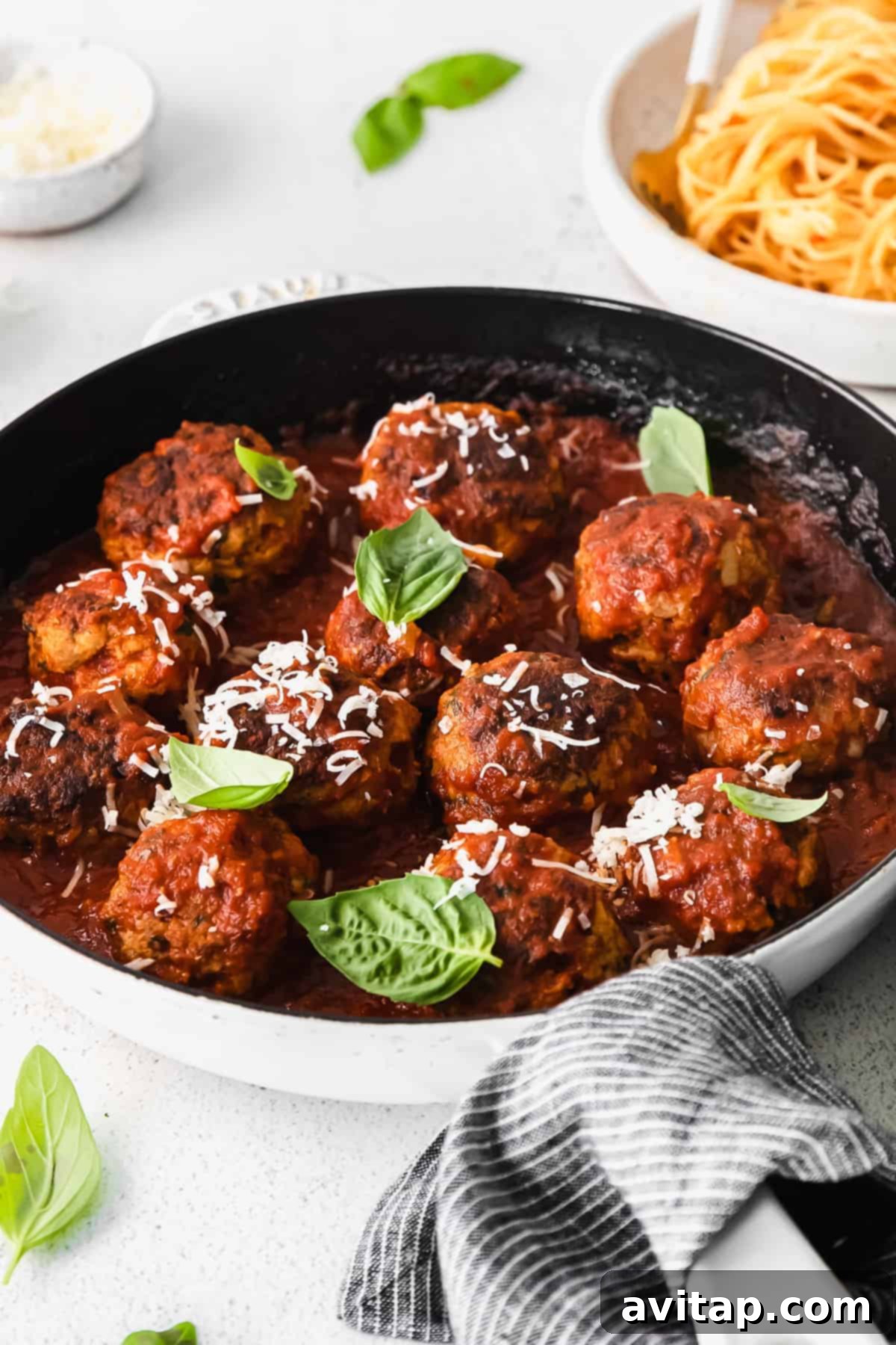 Cooked turkey meatballs carefully packed into a clear freezer-safe plastic bag, ready for storage