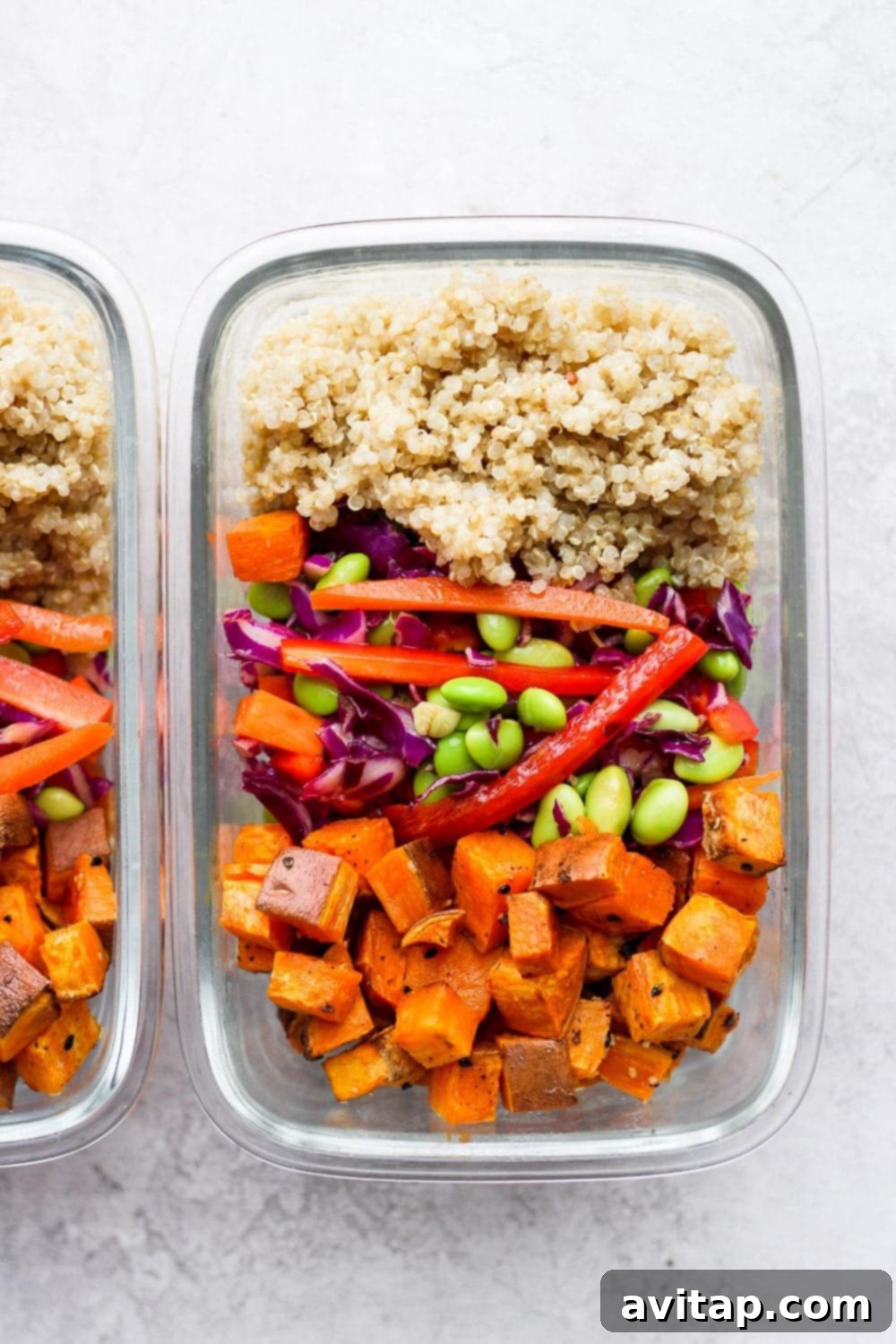 Several Thai Coconut Quinoa Bowls neatly portioned into glass meal prep containers, ready for the week.
