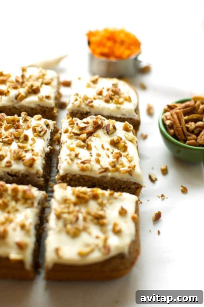 Close-up of healthy carrot cake slice showing moist texture and carrots.