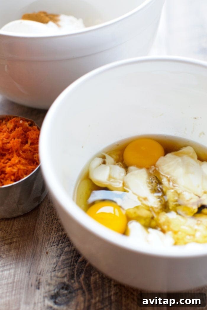 Carrot cake wet ingredients being mixed in a bowl.