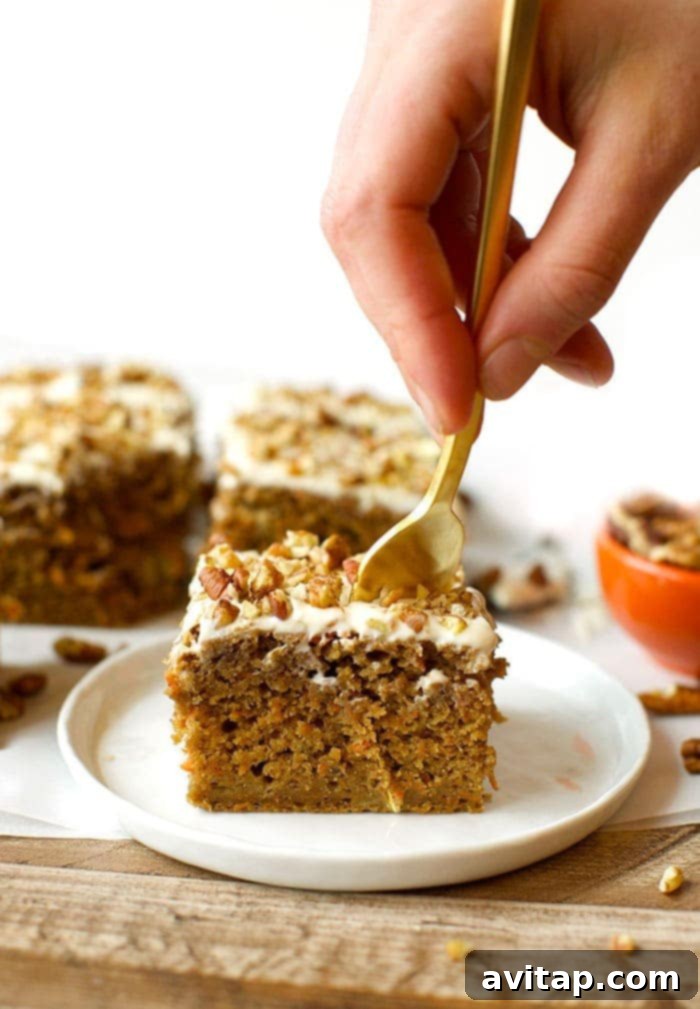 A beautifully frosted healthy carrot cake, ready for serving.