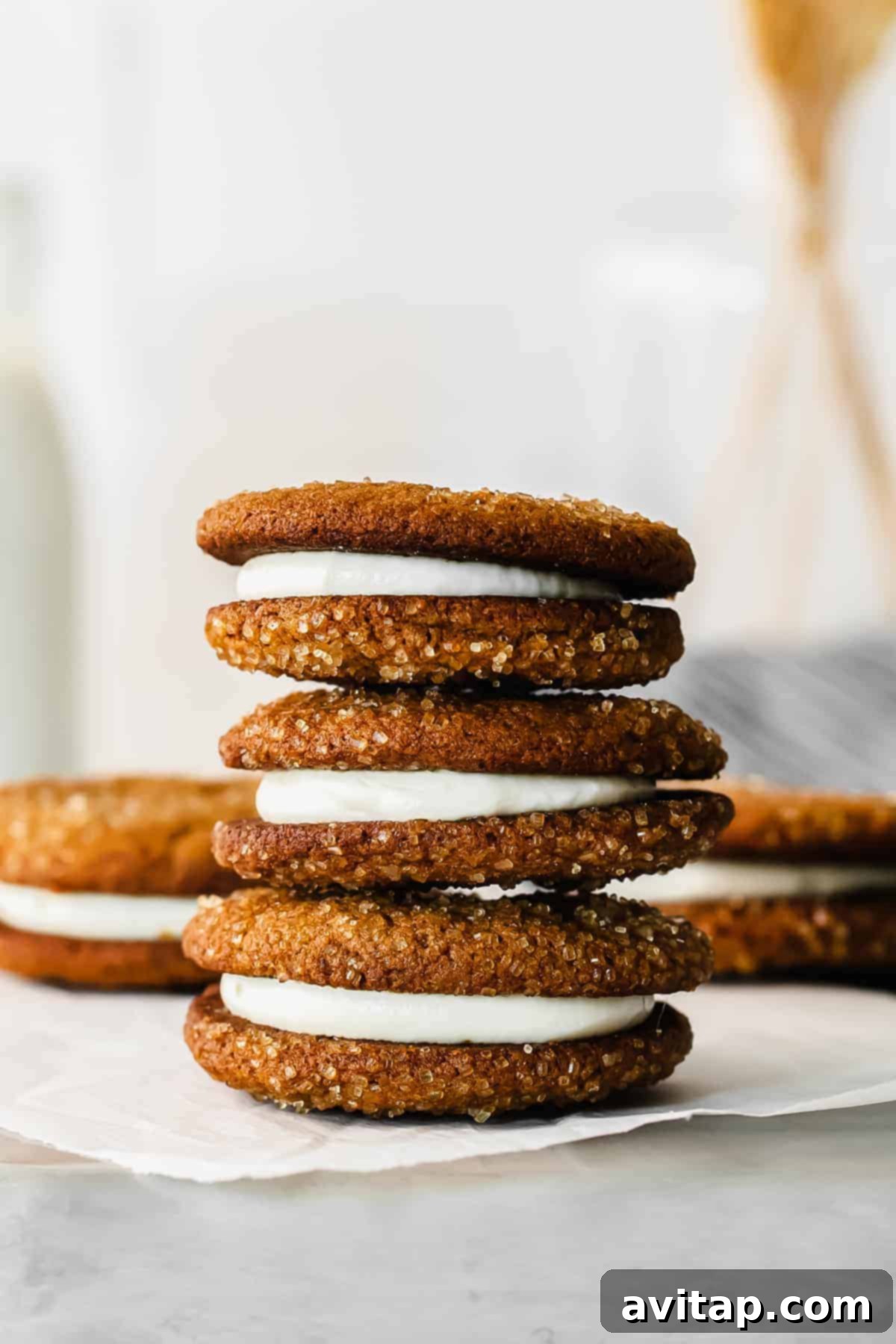 Multiple ginger molasses whoopie pies, beautifully stacked and arranged, ready for serving or gifting during the holidays.