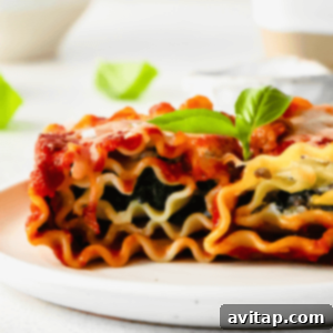 Lasagna roll ups, an individual serving of classic Italian comfort food, golden brown with melted cheese and rich marinara.