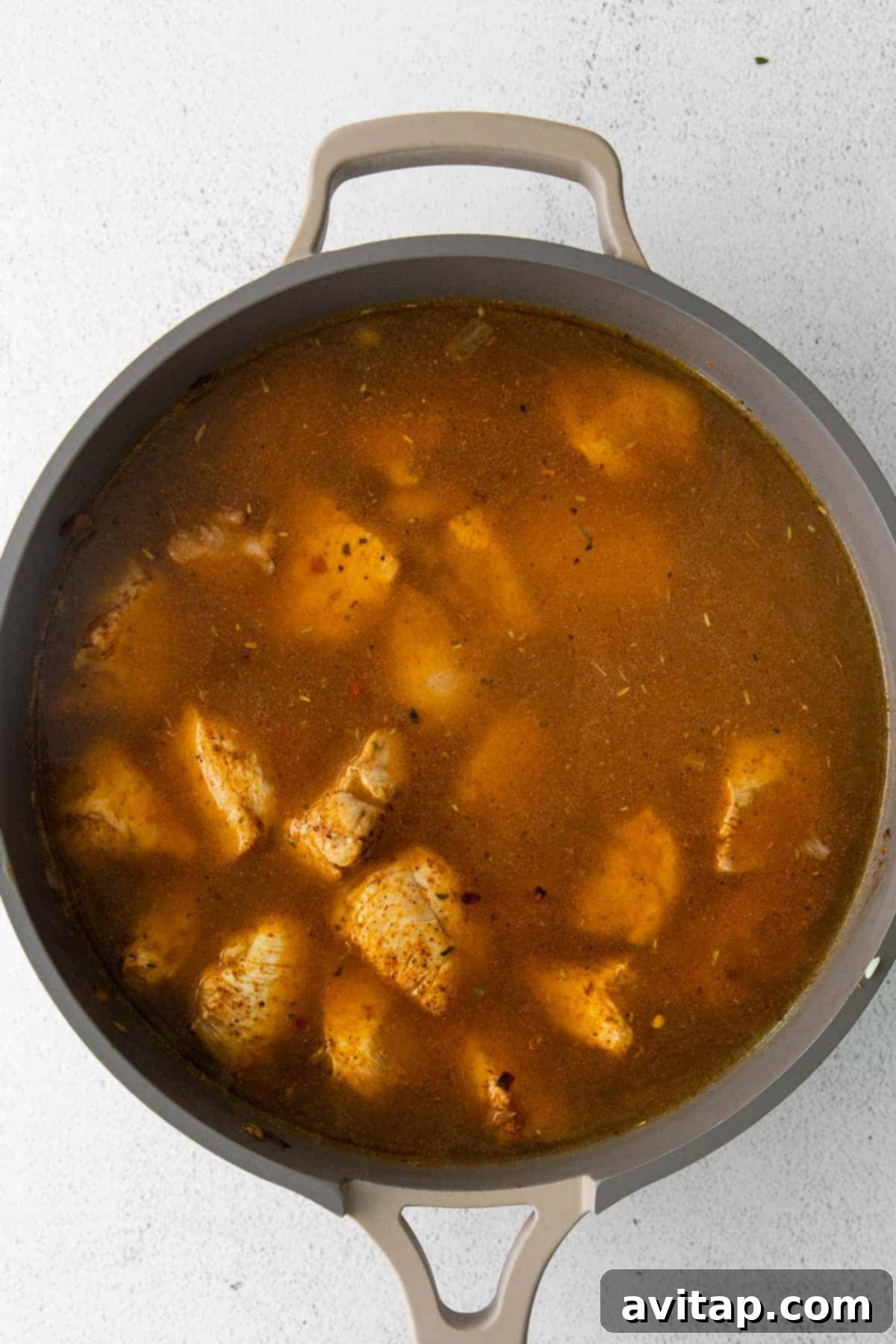 chicken cooking in skillet