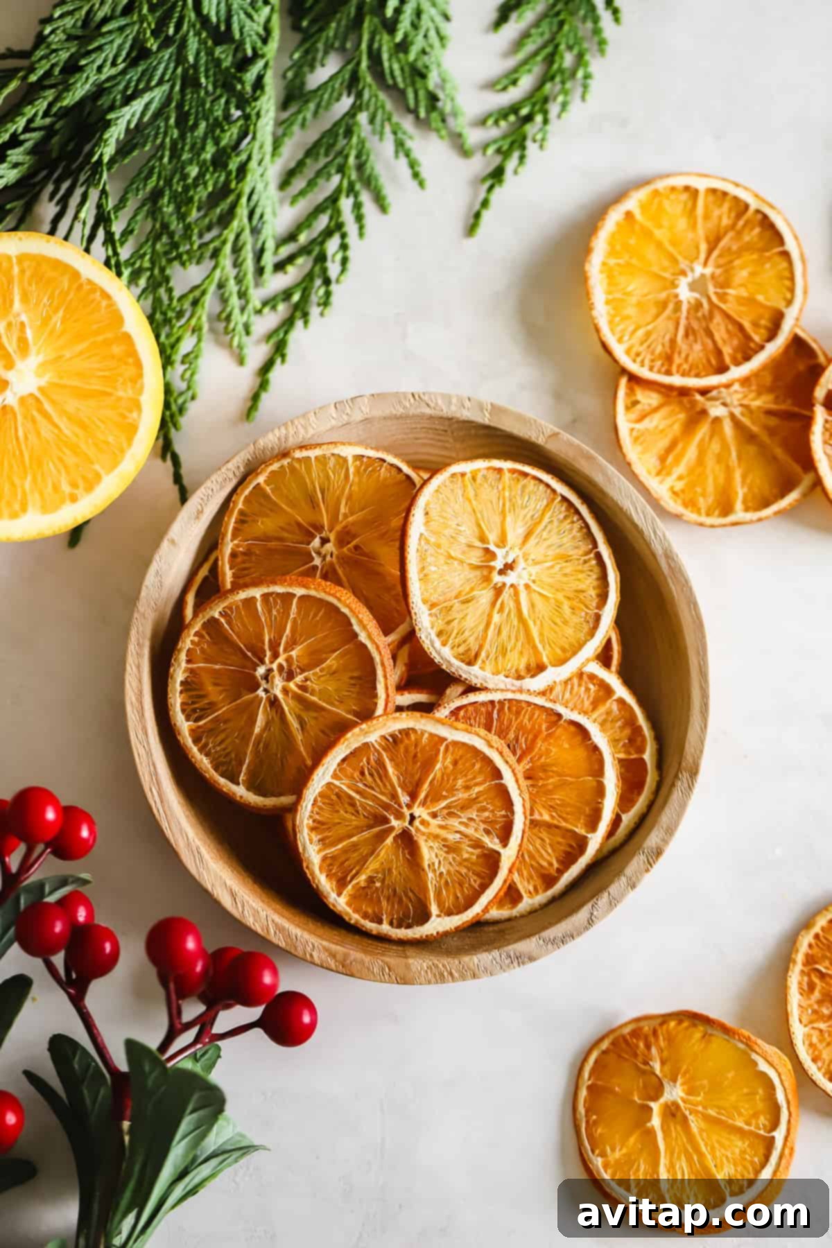 Versatile Dried Orange Slices: Perfect for DIY Holiday Decor Dried oranges in a bowl, ready for various holiday crafts