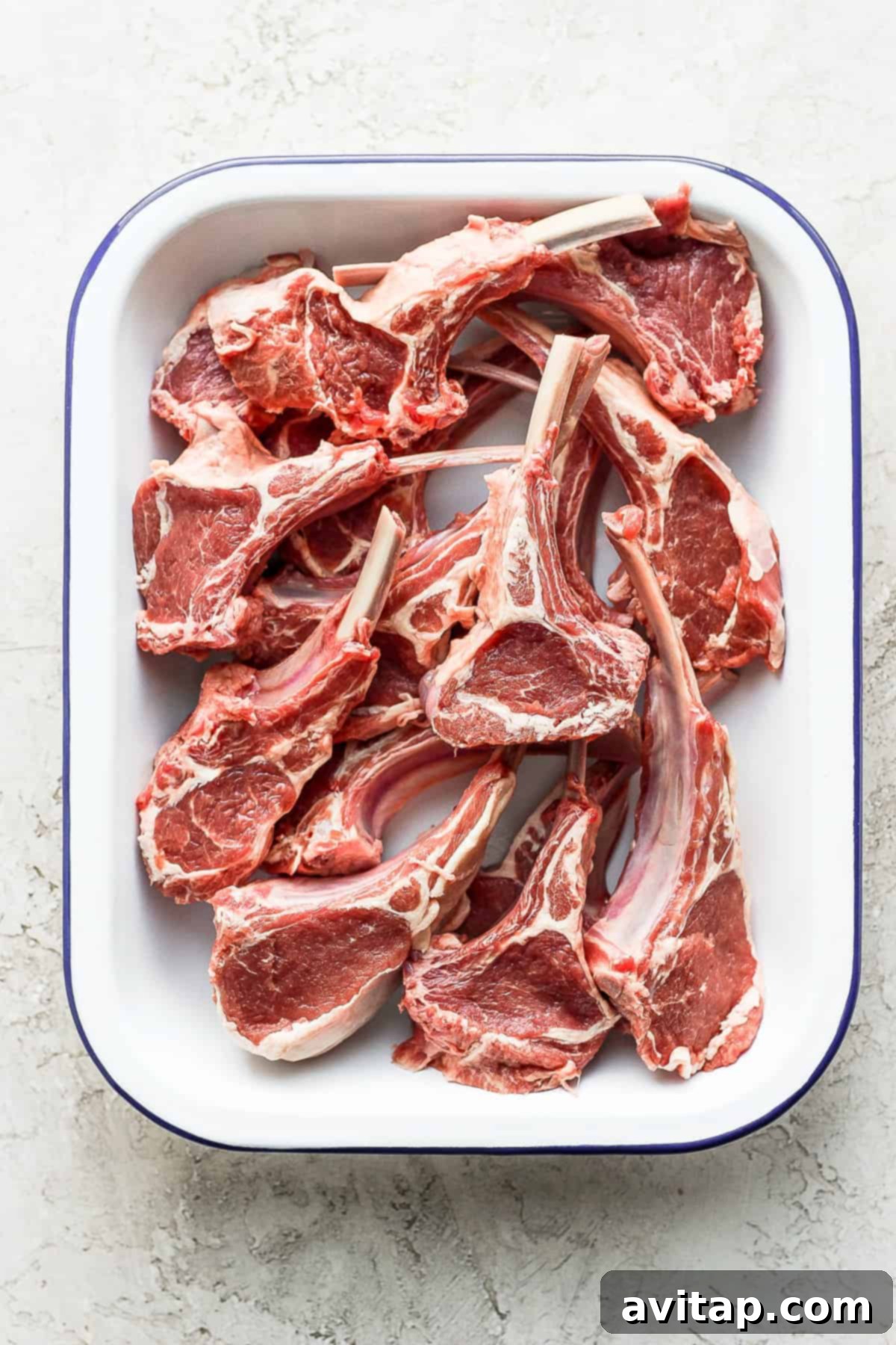 raw lamb chops in a dish
