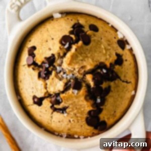 baked oats in a ramekin with toppings