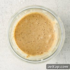 Ingredients for blended baked oats in a bowl, after blending into a smooth batter.