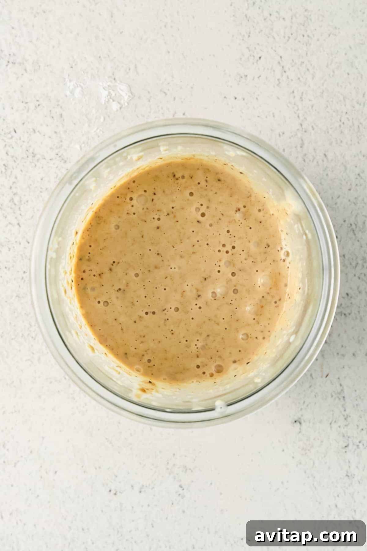 Perfectly Blended Oat Base for Baked Oats Blended baked oatmeal base ingredients smoothly combined in a glass, demonstrating the ideal batter consistency before flavor additions.