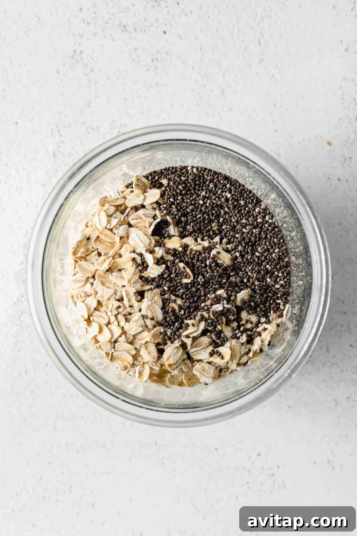 Creamy brown sugar shaken espresso overnight oats in a clear jar, ready to be topped.