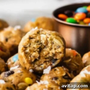 Close-up of a chocolate chip cookie bite with a bite taken out, perfect for the Monster Cookie Protein Balls recipe.